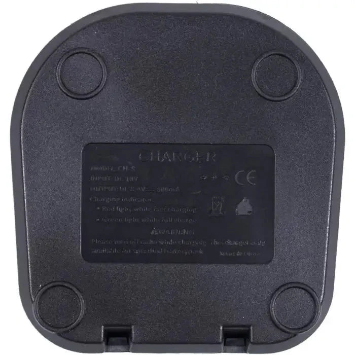 Charger base or charging dock with product information label and circular feet.
