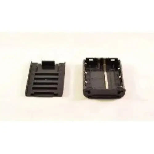 Black plastic battery compartment and cover.