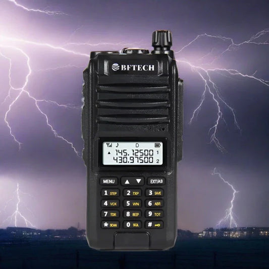 Black handheld two-way radio with a digital display and keypad.