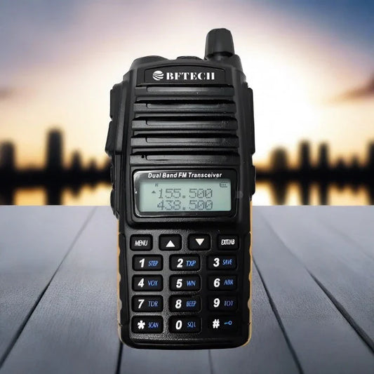 Black dual-band two-way radio with a display and keypad.