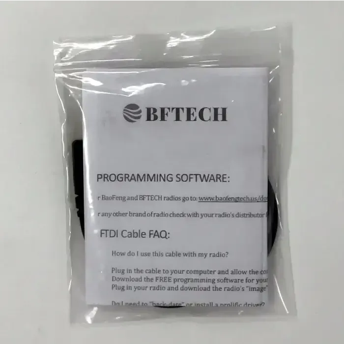 A transparent plastic bag containing a BFTECH programming software instruction manual and a black programming cable.