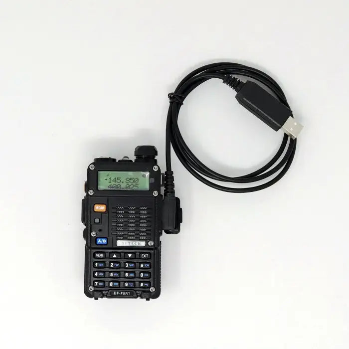 Black handheld two-way radio with a coiled USB programming cable.