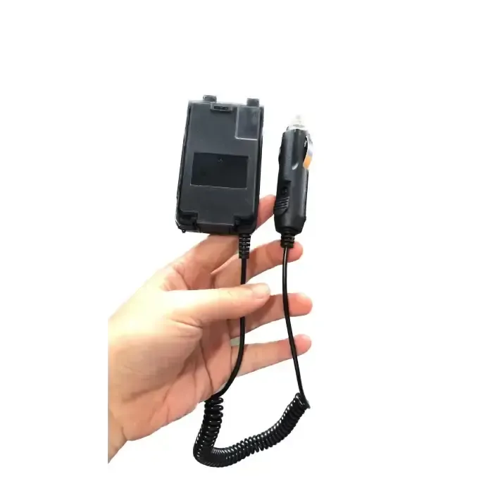 Black car charger with coiled cord.