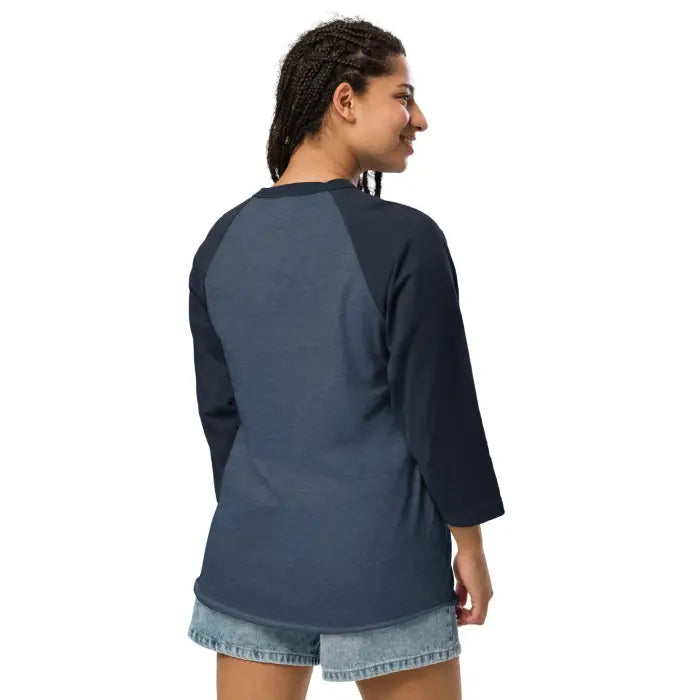 Woman wearing a blue baseball tee.