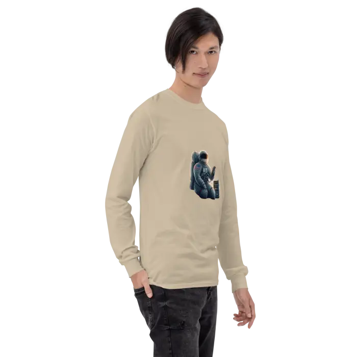 Beige long-sleeved shirt with astronaut graphic.