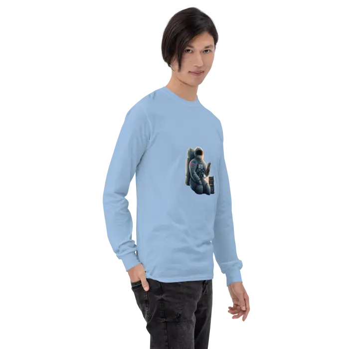 Light blue long-sleeved shirt with astronaut graphic.