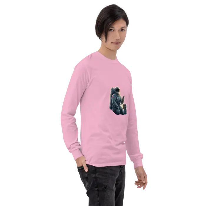 Pink long-sleeved shirt with astronaut graphic.