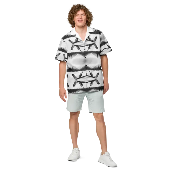 Man in patterned shirt and shorts.