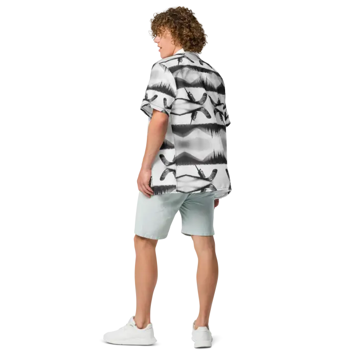 Man in patterned shirt and shorts.