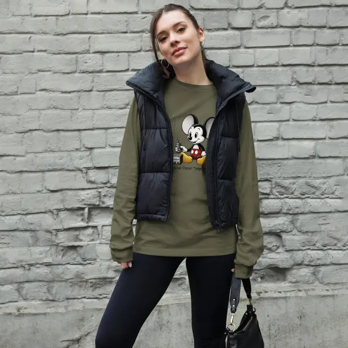 Woman in a black vest and Mickey Mouse shirt.