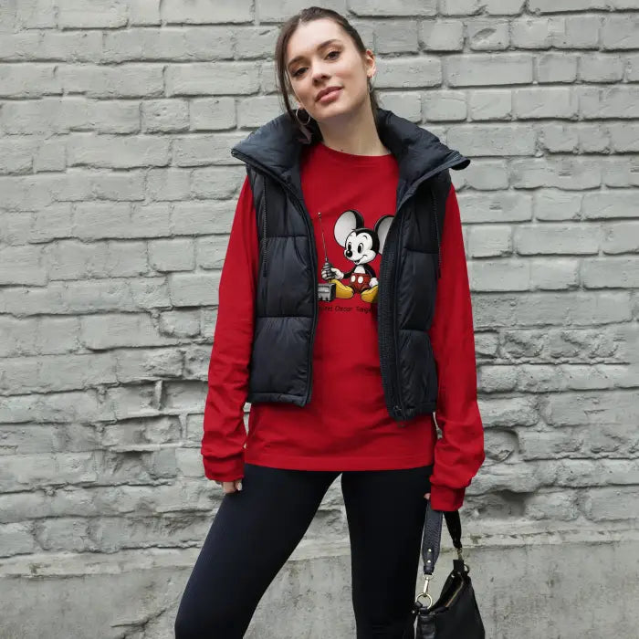 Woman in red Mickey Mouse shirt and black vest.