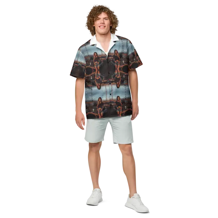 Man in patterned shirt and shorts.