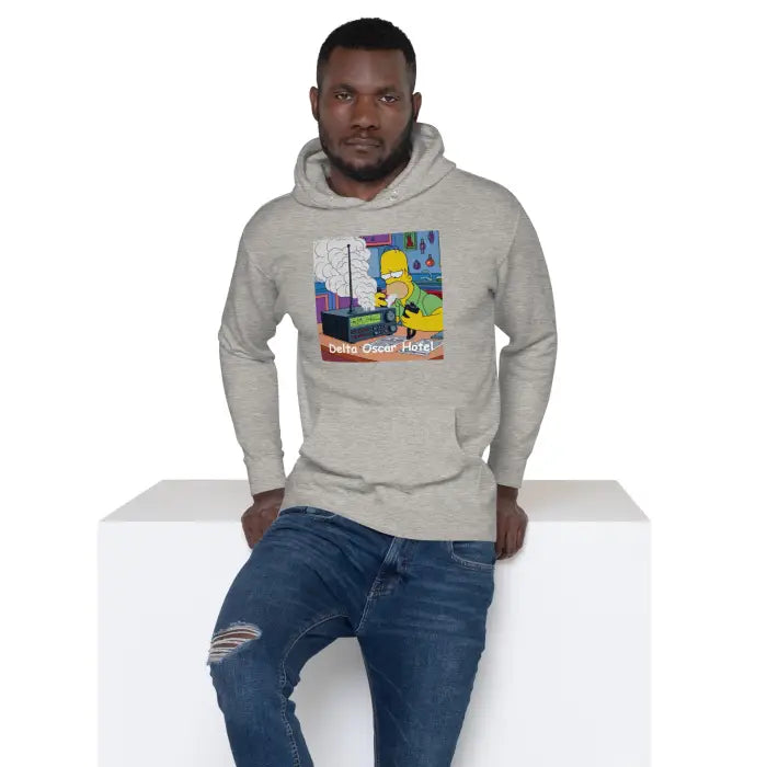 Man wearing a hoodie with a cartoon.