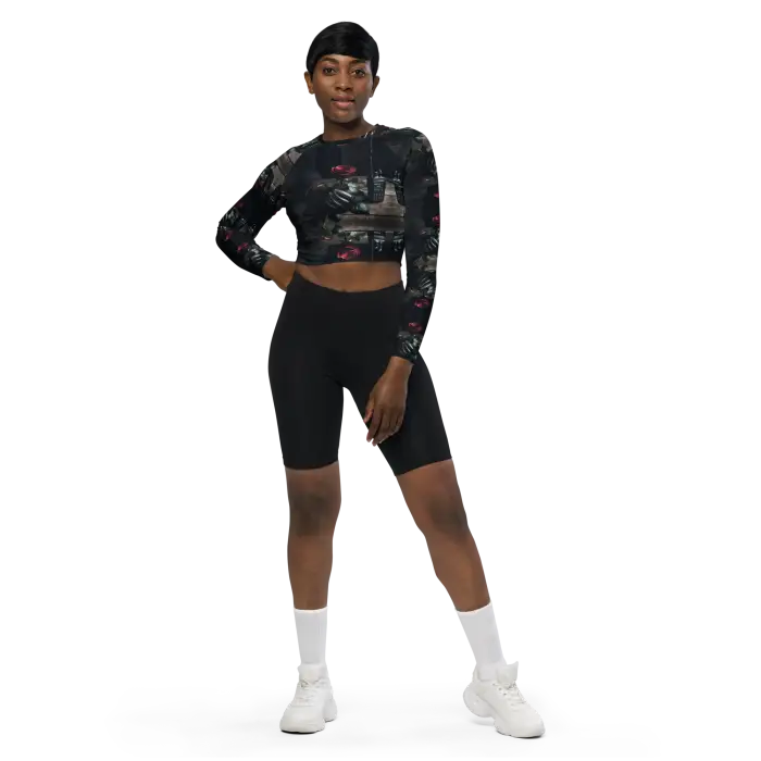 Woman in cropped top and biker shorts.