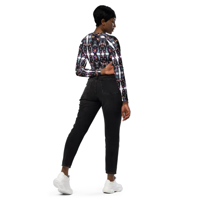 Woman in patterned top and black jeans.