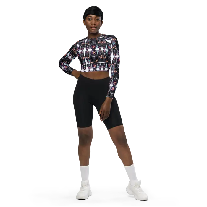 Woman in patterned crop top and black shorts.