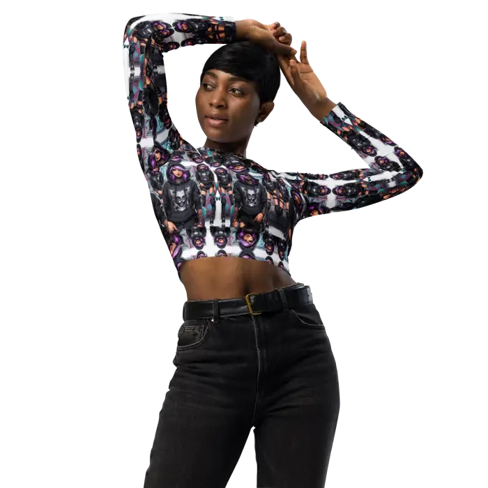 Woman in patterned crop top and black jeans.