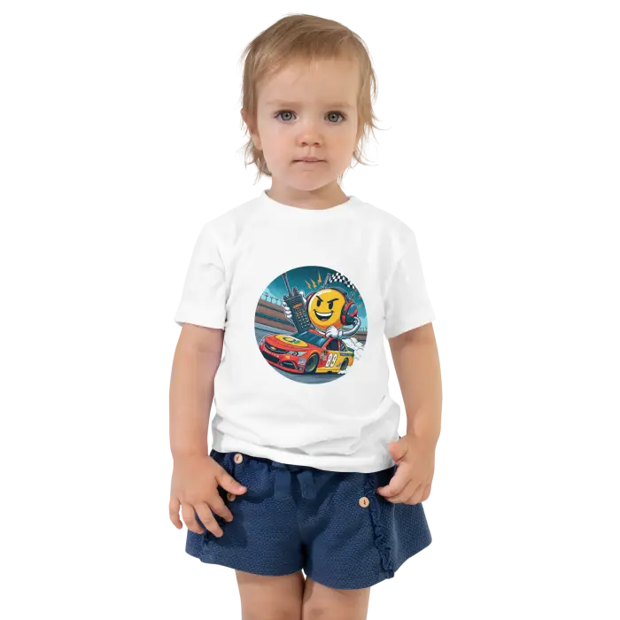 Child wearing a white t-shirt with a racing-themed graphic.