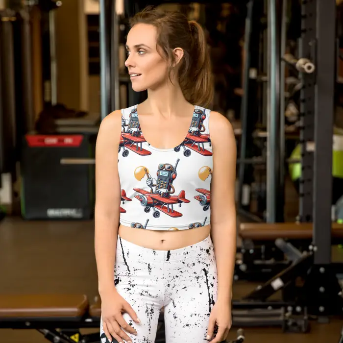 Woman wearing patterned crop top and leggings.
