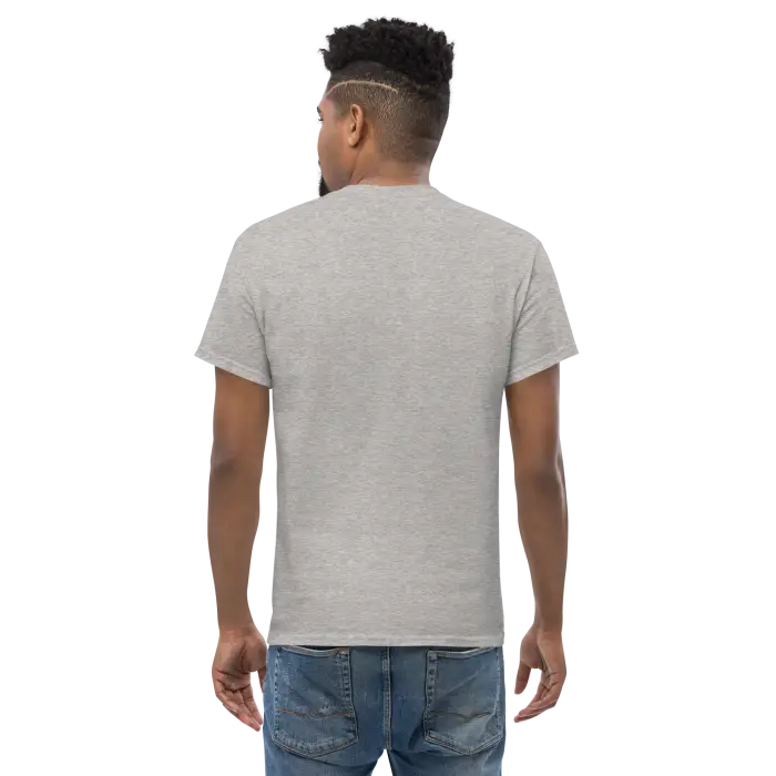Man wearing a gray t-shirt and jeans.