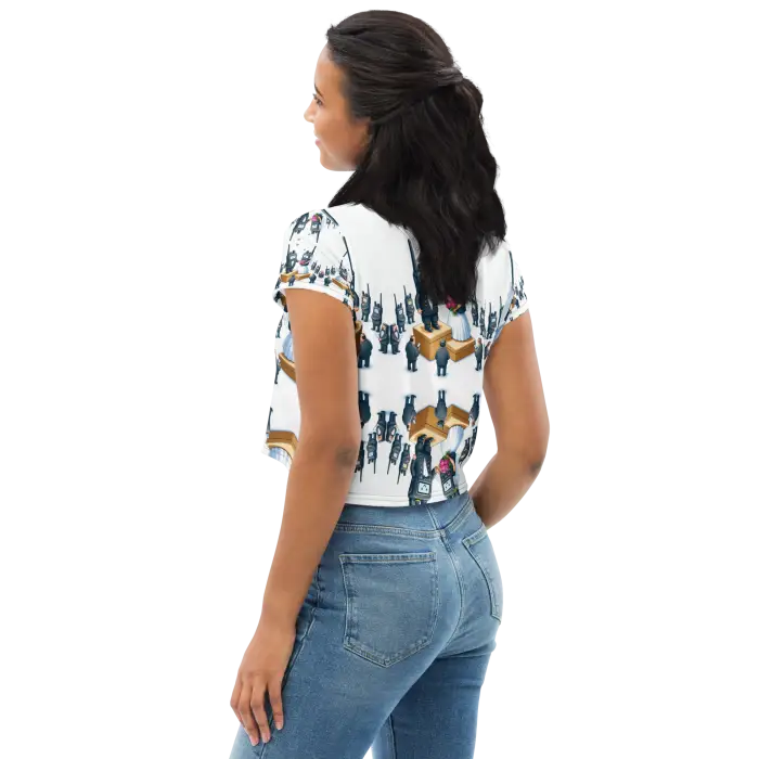 Woman wearing a patterned crop top and jeans.