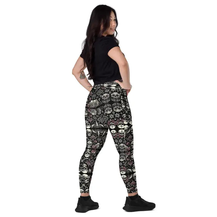 Woman wearing skull-patterned leggings.
