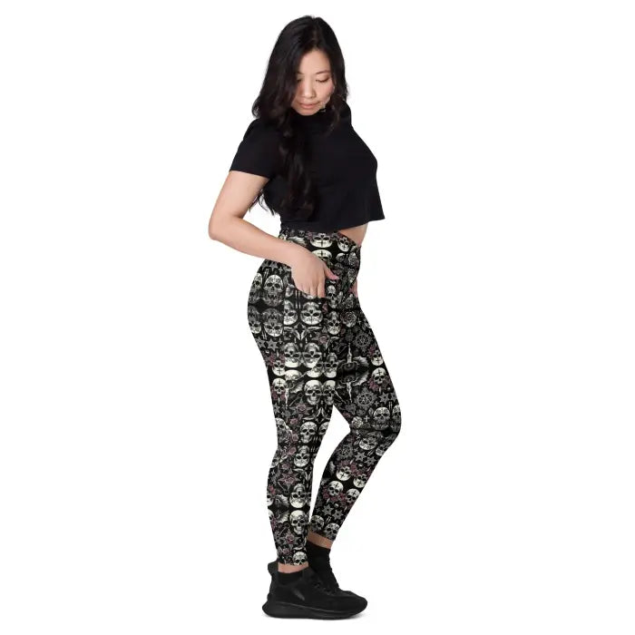 Woman wearing skull-patterned leggings.