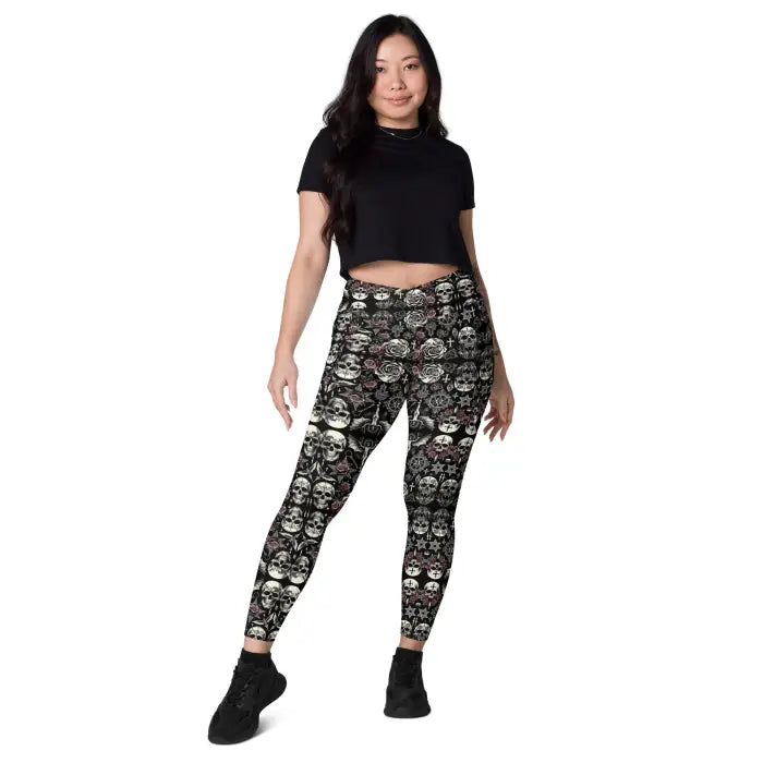 Woman wearing skull-patterned leggings.