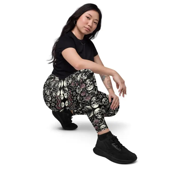 Woman wearing skull-patterned leggings.