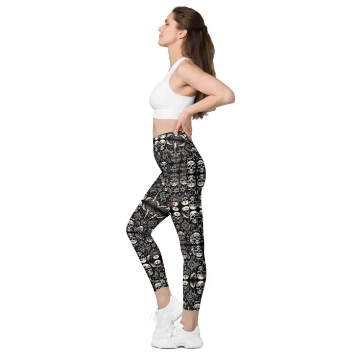 Woman wearing skull-patterned leggings.