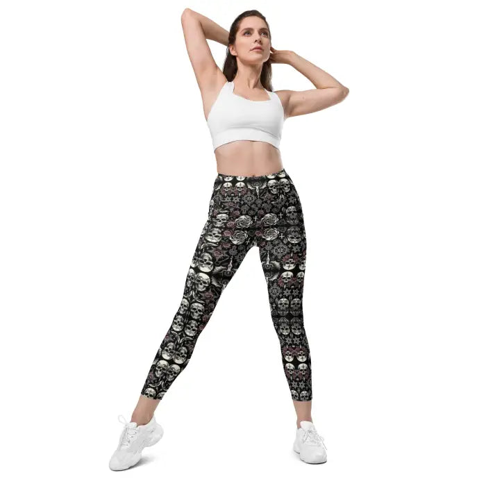 Woman wearing skull-patterned leggings.