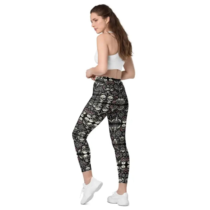 Woman wearing skull-patterned leggings.