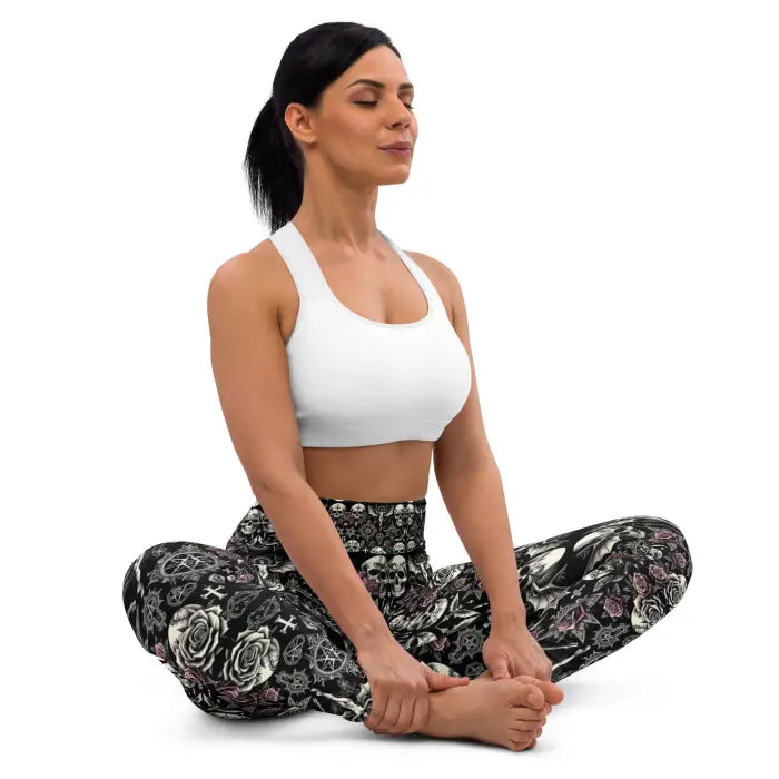 Woman in yoga pose wearing patterned leggings and a sports bra.