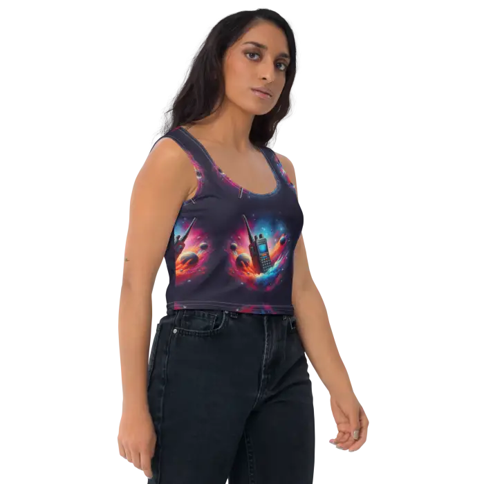 Woman wearing a patterned crop top and jeans.