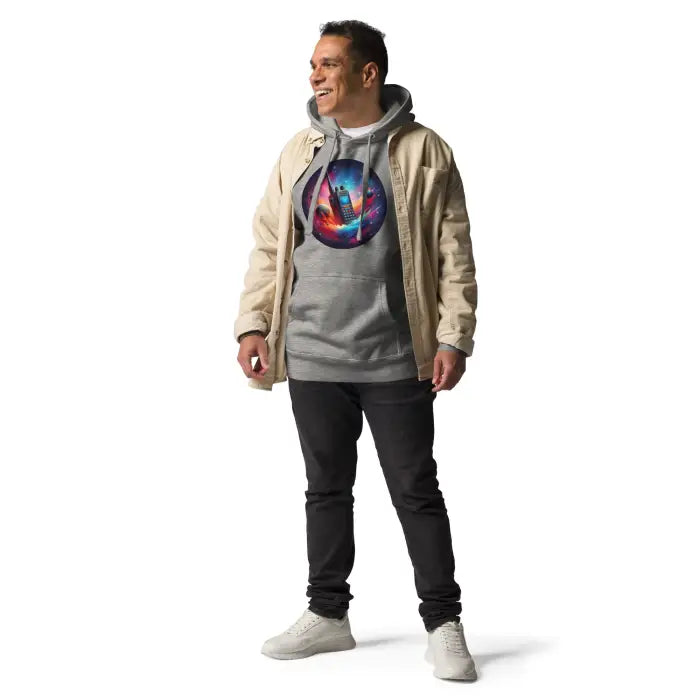 Man wearing a gray hoodie with a colorful space-themed design.