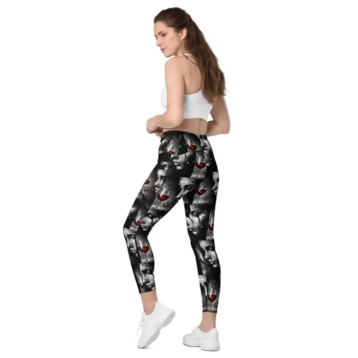 Woman wearing leggings with a face pattern.