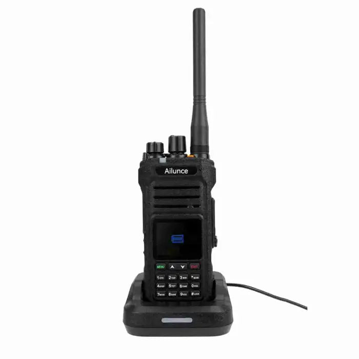 Black two-way radio on charging base.