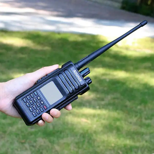 Black walkie-talkie with antenna.