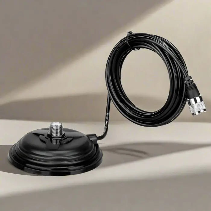 Black magnetic antenna base with coiled cable.
