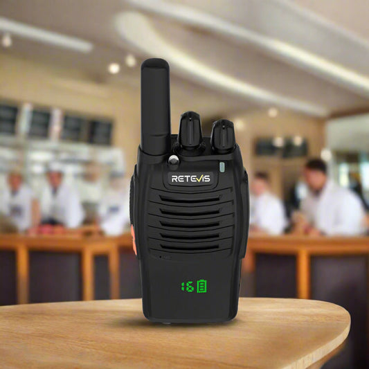 Black two-way radio with an antenna and battery indicator