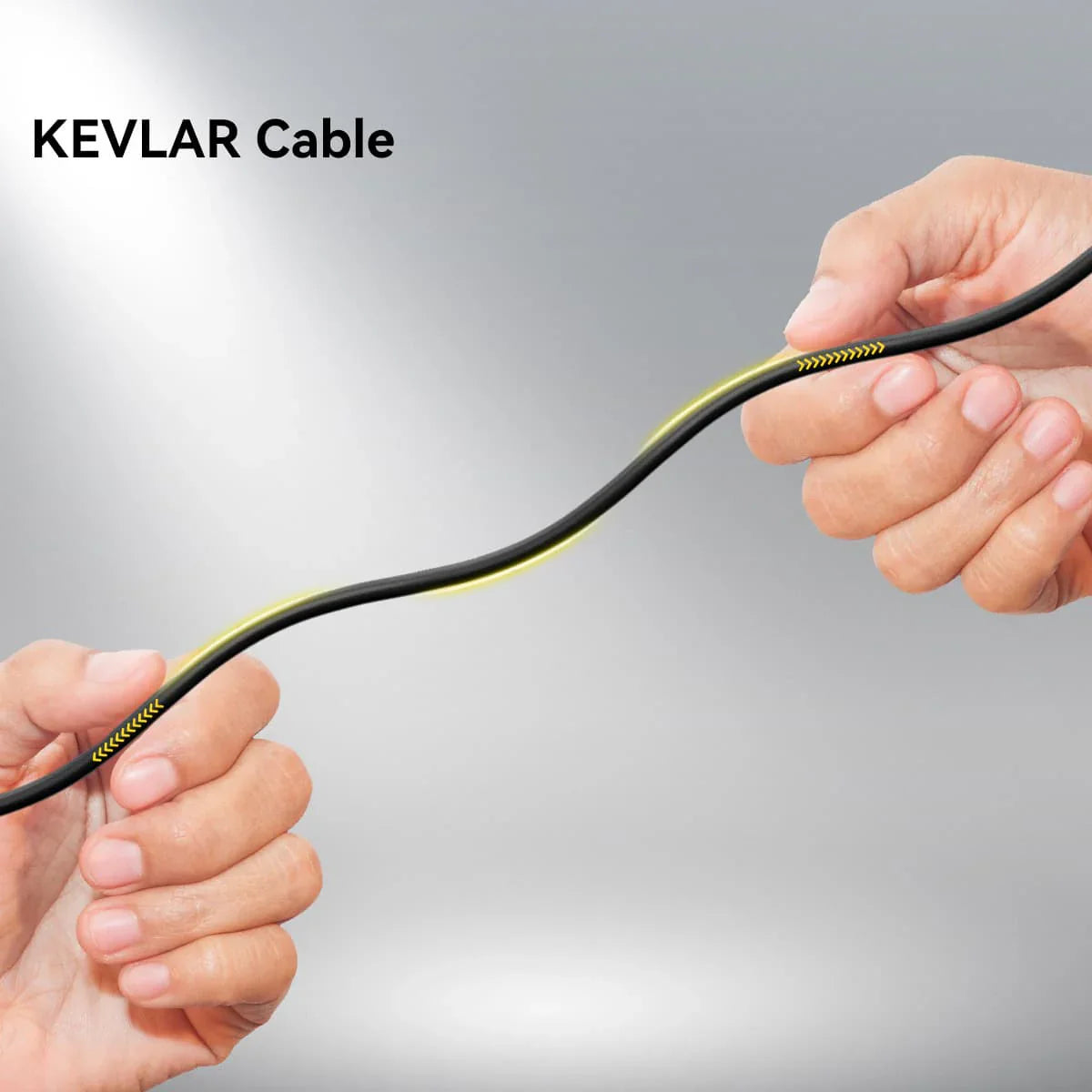 Black Kevlar cable held by two hands.