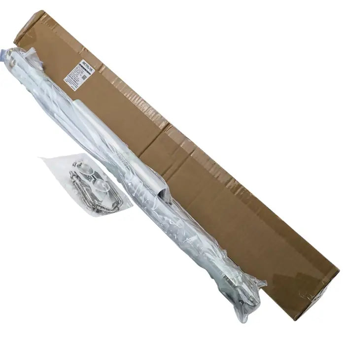 Long, silver, wrapped object with cardboard box.