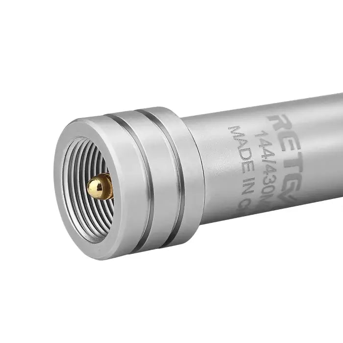 Silver antenna connector with gold pin.