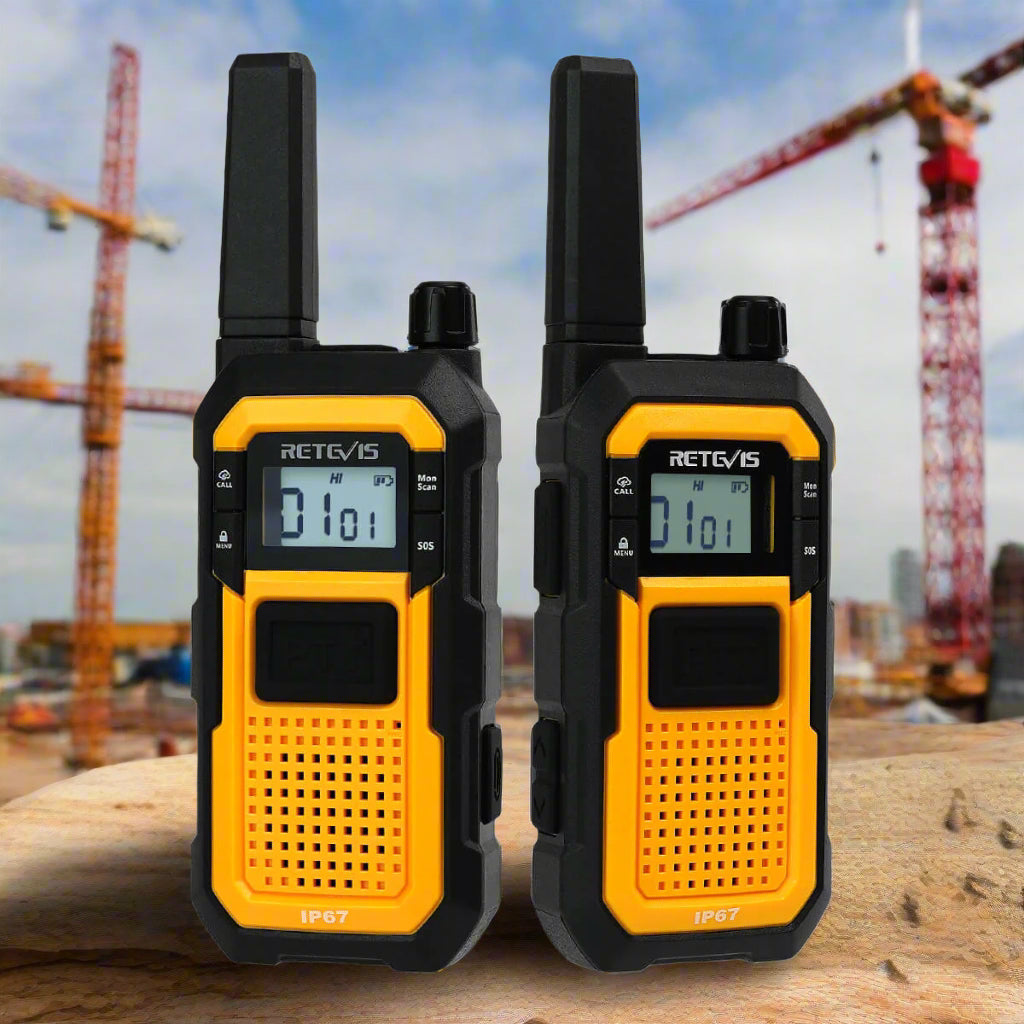 Two black and yellow walkie-talkies with digital displays and antennas.