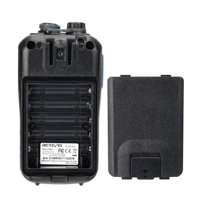 Black two-way radio with battery compartment open.