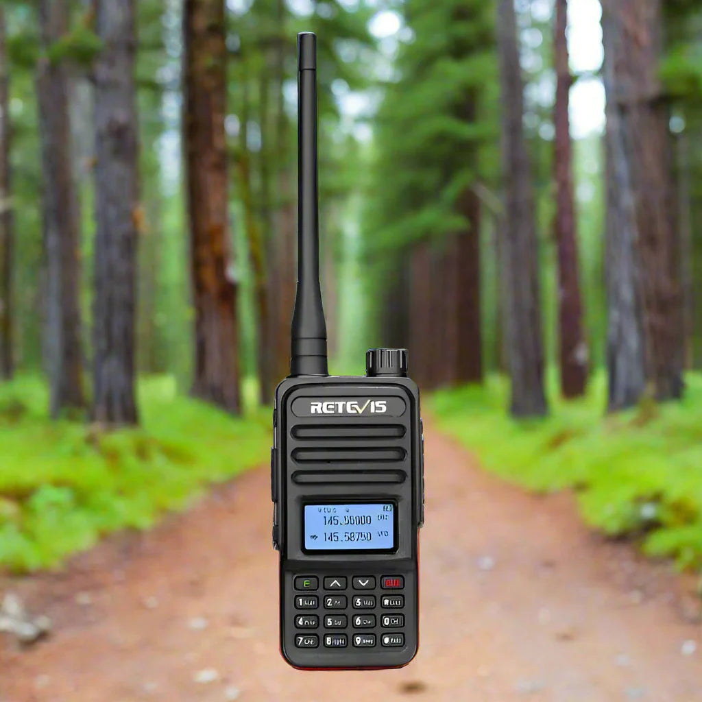 Handheld two-way radio with an antenna and digital display screen.