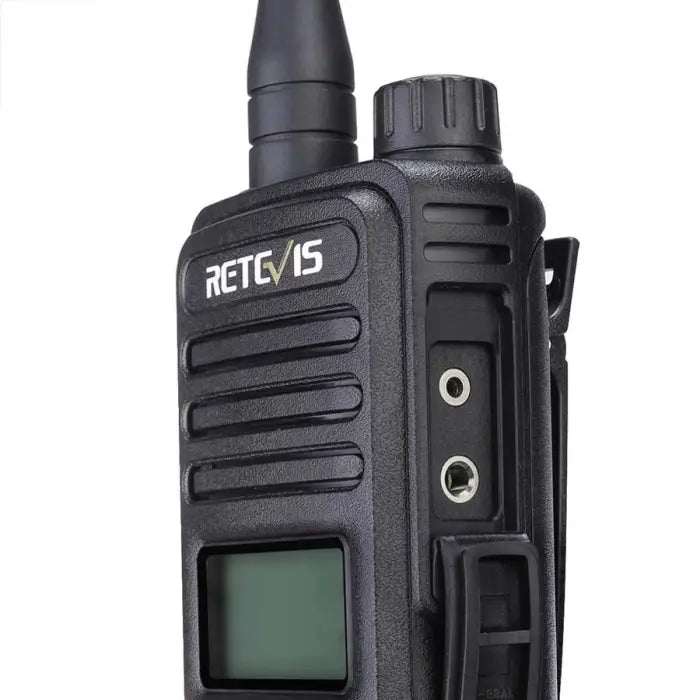 Handheld two-way radio with antenna and digital display.