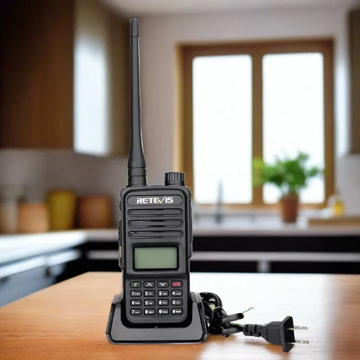 Black two-way radio on charging base.