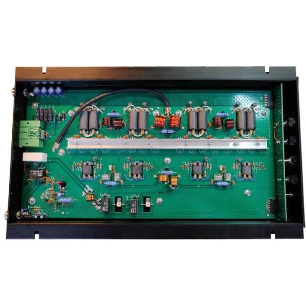 Green circuit board with electronic components.