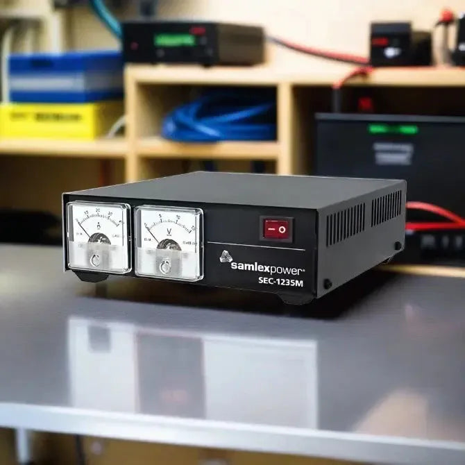 Samlex power supply unit with two analog meters and a power switch on the front panel.